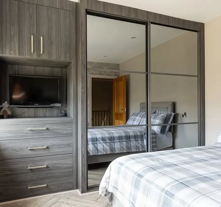 Wall to wall fitted sliding wardrobe with drawers